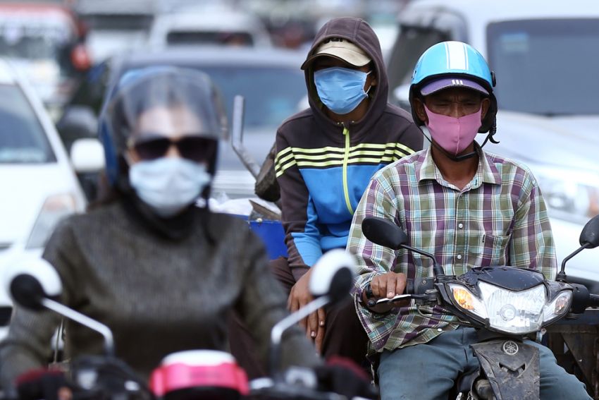 topic-8.-people-wear-face-masks-to-protect-coronavirus-covid19-on-the-way-in-meanchey-district-in-phnom-penh-on-march-17-2020-by-hong-menea-1